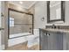 Bathroom with tub, shower, and dark vanity with granite countertop at 130 Vista Del Mar Ln. # 1-703, Myrtle Beach, SC 29572