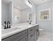 Modern bathroom featuring double sinks, gray cabinets, and marble tile at 219 West Palms Dr., Myrtle Beach, SC 29579