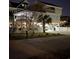 Night view of a two-story beach house with outdoor lighting at 220 N Yaupon Dr., Surfside Beach, SC 29575