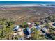 Aerial view of home highlighting coastal location and nearby marsh and beaches at 189 Brown Pelican Loop, Pawleys Island, SC 29585