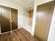 Bathroom featuring a walk-in shower with wood tile and natural light with a double door entrance to the right at 189 Brown Pelican Loop, Pawleys Island, SC 29585