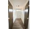 Laundry room with wood-look flooring and two doors at 189 Brown Pelican Loop, Pawleys Island, SC 29585