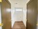 Spacious laundry room with wood floors, modern lighting, and space for laundry appliances, offering functionality at 189 Brown Pelican Loop, Pawleys Island, SC 29585