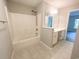 Large main bedroom with wood-look floors and multiple doorways at 412 Callie Dr., Myrtle Beach, SC 29588