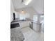 Bright kitchen featuring white cabinetry, granite counters, and stainless steel appliances at 412 Callie Dr., Myrtle Beach, SC 29588