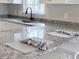Close up of kitchen island with gray granite countertops at 412 Callie Dr., Myrtle Beach, SC 29588