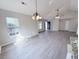 Bright living room with updated laminate floors and vaulted ceilings at 412 Callie Dr., Myrtle Beach, SC 29588