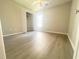 Well-lit bedroom featuring wood-look floors and an open doorway at 412 Callie Dr., Myrtle Beach, SC 29588