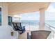 Condo balcony with chairs facing the ocean and offering seating for three at 5800 N Ocean Blvd. # 705, North Myrtle Beach, SC 29582