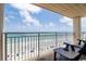 Relaxing condo balcony with ocean views, comfortable seating, and sunny skies at 5800 N Ocean Blvd. # 705, North Myrtle Beach, SC 29582