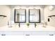 Elegant bathroom with double vanity, square mirrors, modern lighting, and sleek fixtures for a contemporary aesthetic at 5800 N Ocean Blvd. # 705, North Myrtle Beach, SC 29582