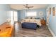Bright bedroom with balcony access and beach-themed decor offers relaxation at 5800 N Ocean Blvd. # 705, North Myrtle Beach, SC 29582