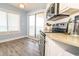 Bright kitchen with stainless appliances, granite countertops, and a view of the ocean beyond the balcony at 5800 N Ocean Blvd. # 705, North Myrtle Beach, SC 29582
