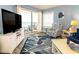 Cozy living room with a comfortable couch and chairs and a great ocean view at 5800 N Ocean Blvd. # 705, North Myrtle Beach, SC 29582