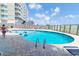 Outdoor pool surrounded by deck furniture, perfect for relaxation and recreation at this property at 5800 N Ocean Blvd. # 705, North Myrtle Beach, SC 29582