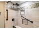 Updated shower with elegant tile work, a rainfall shower head, and recessed storage niches at 5800 N Ocean Blvd. # 705, North Myrtle Beach, SC 29582