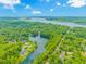 Beautiful aerial view of home, lake, and lush greenery in this serene neighborhood at 148 Heather Dr., Pawleys Island, SC 29585