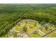 Aerial view of the community highlighting the serene pond and well-maintained homes at 252 Timber Run Dr., Georgetown, SC 29440