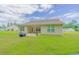 Spacious backyard featuring well-maintained lawn, an outdoor patio, and the home's rear exterior at 252 Timber Run Dr., Georgetown, SC 29440