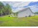 Expansive backyard featuring well-maintained lawn, an outdoor patio, and the home's exterior at 252 Timber Run Dr., Georgetown, SC 29440