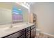 Bathroom featuring double sink vanity with dark cabinets and a large mirror at 252 Timber Run Dr., Georgetown, SC 29440