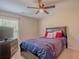 This bedroom features a ceiling fan and a large window at 252 Timber Run Dr., Georgetown, SC 29440