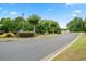 A welcoming gated entrance to the community with manicured landscaping and mature trees at 252 Timber Run Dr., Georgetown, SC 29440
