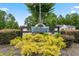 Well maintained community sign with lush greenery and tasteful landscaping at 252 Timber Run Dr., Georgetown, SC 29440
