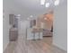 Open kitchen area with modern stools at the bar, seamlessly connecting to the living room at 252 Timber Run Dr., Georgetown, SC 29440