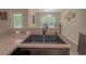 Close-up view of the kitchen sink and countertop, with a glimpse into the adjacent dining area at 252 Timber Run Dr., Georgetown, SC 29440