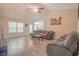 Spacious living room with vaulted ceiling, hardwood floors, and gray couches at 252 Timber Run Dr., Georgetown, SC 29440