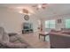Comfortable living room with ample natural light, ceiling fan, and seamless flow into other areas at 252 Timber Run Dr., Georgetown, SC 29440