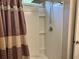 Shower with a rainfall shower head behind a patterned shower curtain at 252 Timber Run Dr., Georgetown, SC 29440