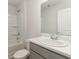 Well-lit bathroom featuring a modern vanity, sink, toilet, and a shower/tub combination at 116 Arbor Crest Ln., Tabor City, NC 28463