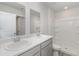 Bathroom featuring double sinks with modern fixtures, ample counter space, and a tub-shower combo at 116 Arbor Crest Ln., Tabor City, NC 28463