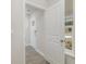 A bright entryway featuring light gray vinyl plank flooring and a view of the front door at 116 Arbor Crest Ln., Tabor City, NC 28463