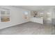 A contemporary kitchen featuring new gray vinyl plank flooring and lots of light shining through windows at 116 Arbor Crest Ln., Tabor City, NC 28463