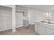 Kitchenette with gray cabinetry, stainless sink, and a pantry with wire shelving at 116 Arbor Crest Ln., Tabor City, NC 28463