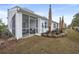 Landscaped backyard with screened porch at 2365 Elowen Ln. # 13E, Longs, SC 29568