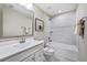 Clean bathroom with a white vanity, bathtub, and gray tile at 2365 Elowen Ln. # 13E, Longs, SC 29568