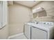 Laundry room with washer, dryer, and overhead shelving at 2365 Elowen Ln. # 13E, Longs, SC 29568