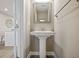 Small powder room with pedestal sink and mirror at 2365 Elowen Ln. # 13E, Longs, SC 29568