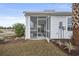 White screened porch with access from backyard at 2365 Elowen Ln. # 13E, Longs, SC 29568