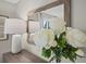 Elegant vanity with white peonies, adding a touch of beauty at 2365 Elowen Ln. # 13E, Longs, SC 29568