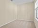 Empty bedroom with window and neutral colored walls at 6625 Scotsman Crescent, Myrtle Beach, SC 29588