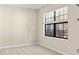 Cozy bedroom with a large window and neutral walls at 6625 Scotsman Crescent, Myrtle Beach, SC 29588