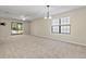 Spacious dining room with large window and chandelier at 6625 Scotsman Crescent, Myrtle Beach, SC 29588