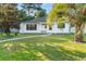 Charming white house with palm tree and walkway at 6625 Scotsman Crescent, Myrtle Beach, SC 29588