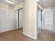 Hallway with mirrored closet doors and light flooring at 6625 Scotsman Crescent, Myrtle Beach, SC 29588