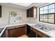 Kitchen with double sink and window view at 6625 Scotsman Crescent, Myrtle Beach, SC 29588